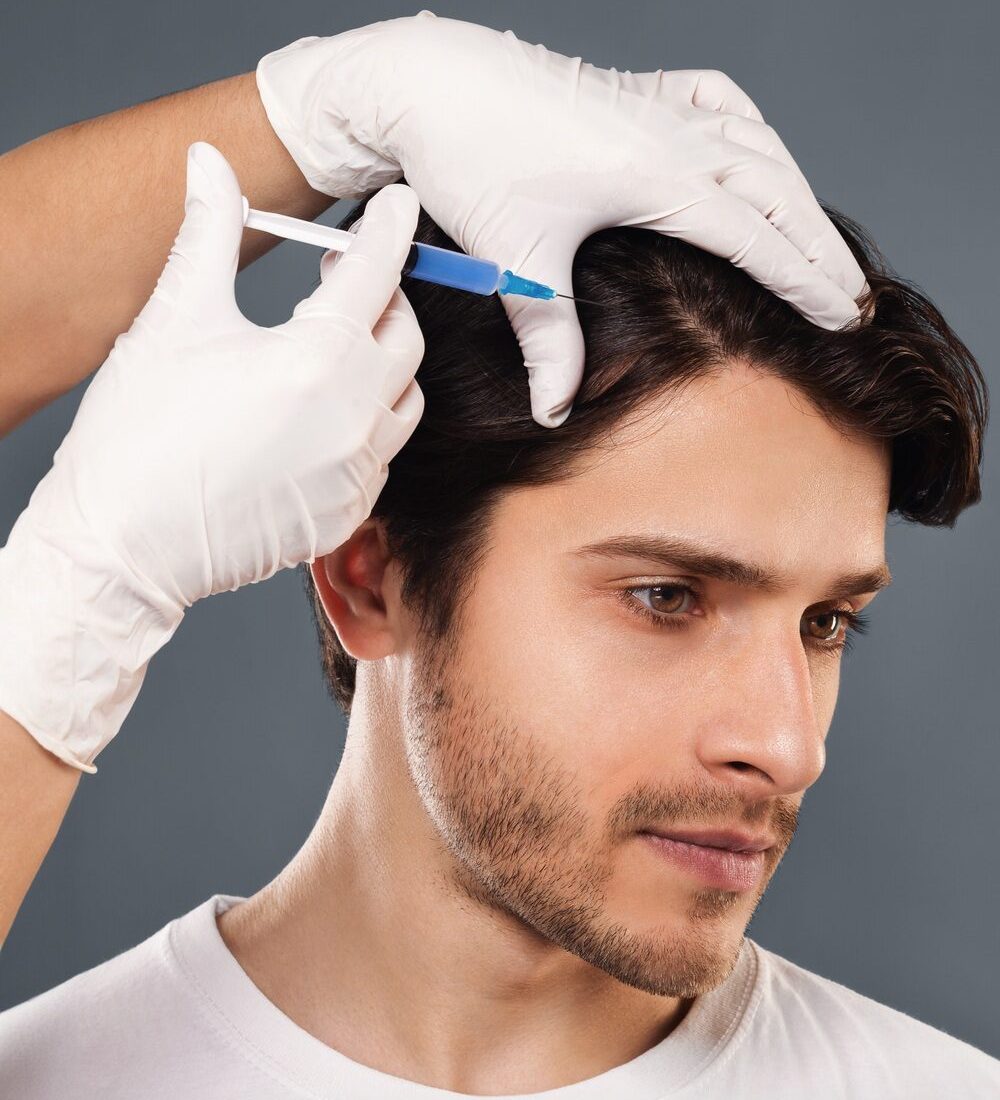 Man with hair loss problem receiving injection in head